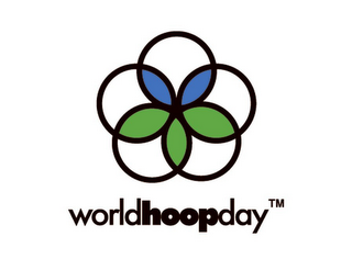 5 CIRCLE FLOWER WITH CLEAR OR WHITE, BLUE AND GREEN PETALS; WORLD HOOP DAY