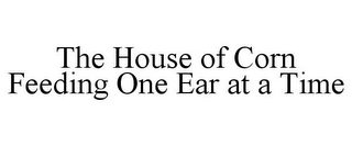 THE HOUSE OF CORN FEEDING ONE EAR AT A TIME