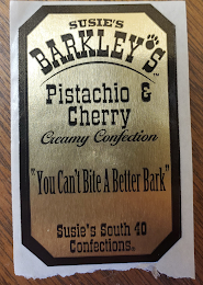 SUSIE'S BARKLEY'S TM PISTACIO AND CHERRY CREAMY CONFECTION "YOU CAN'T BITE A BETTER BARK" SUSIES'S SOUTH 40 CONFECTIONS R