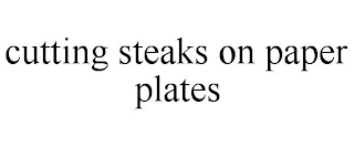 CUTTING STEAKS ON PAPER PLATES