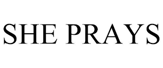 SHE PRAYS