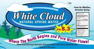 WHITE CLOUD NATURAL SPRING WATER FROM AN ALKALINE, ARTESIAN SPRING PH 8.3 WHERE THE NORTH BEGINS AND PURE WATER FLOWS! WHITE CLOUD MICHIGAN MANISTEE NATIONAL FOREST LAND AREA PROTECTED BY LAW BOTTLED AT THE SOURCE