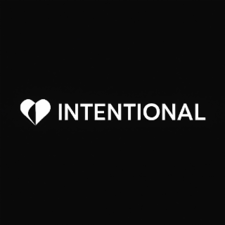 INTENTIONAL LOGO BLACK & WHITE SOLID BLACK (#000000) BACKGROUND AS THE FOUNDATION HEART ICON & TEXT ("INTENTIONAL"):PURE WHITE - MAXIMUM LEGIBILITY AND VISUAL IMPACT AGAINST THE BLACK BACKGROUND